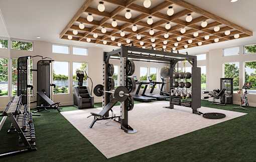 A gym with a variety of equipment including a squat rack, bench, and weights.