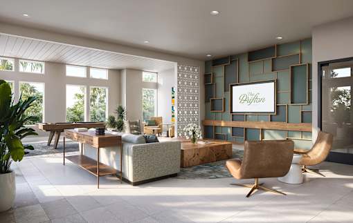 A modern living room with a sofa, armchair, and a coffee table.