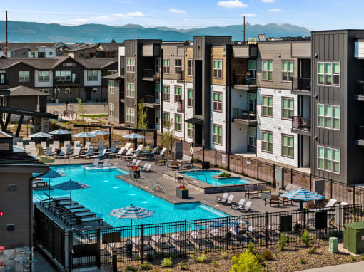 an aerial view of a swimming pool at an apartment complex