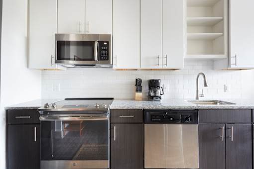 A modern kitchen with a black and white color scheme.