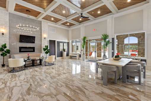 a large living room with a marble floor and a fireplace