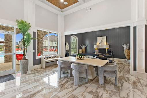a dining room with a table and chairs