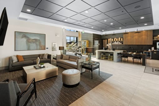 a lobby with couches and chairs and a bar and a living room