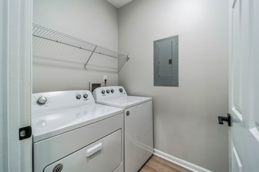 a washer and dryer in a laundry room with a door