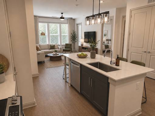 A modern kitchen with a large island and a dining area.