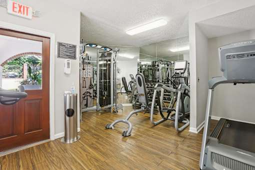 Apartments in Atlanta GA with In-Unit Washer and Dryer - Virginia Highlands - Fitness Center with Cardio Machines, Strength-Training Equipment, and Mirrored Walls.