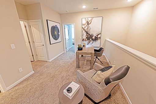 a living room with a chair and table
