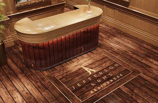 A wooden bathtub with a sign that says "Jefferson Apartments" in front of it.