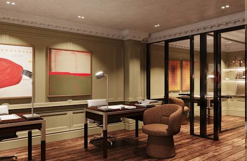 A room with a brown chair and a table with a lamp on it.