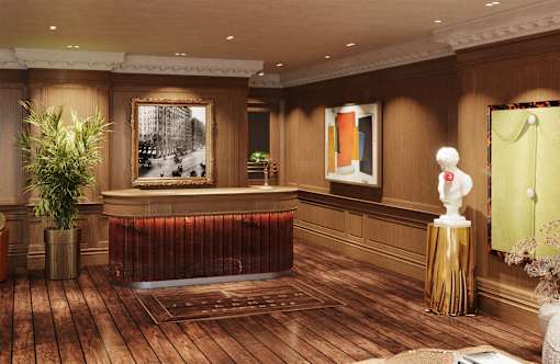 A reception area with a wooden floor and a red reception desk.