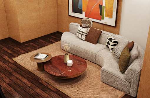 A living room with a grey couch, a coffee table, and a painting on the wall.