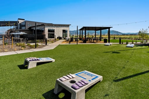 a park with benches and a building in the background