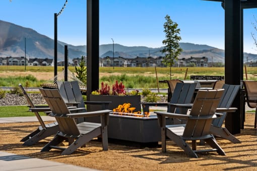 a group of chairs sitting around a table on a patio