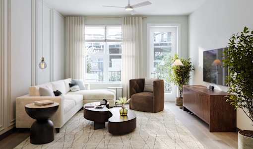 a living room filled with furniture and a large window
