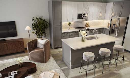 a kitchen with a center island and a sink in a living room
