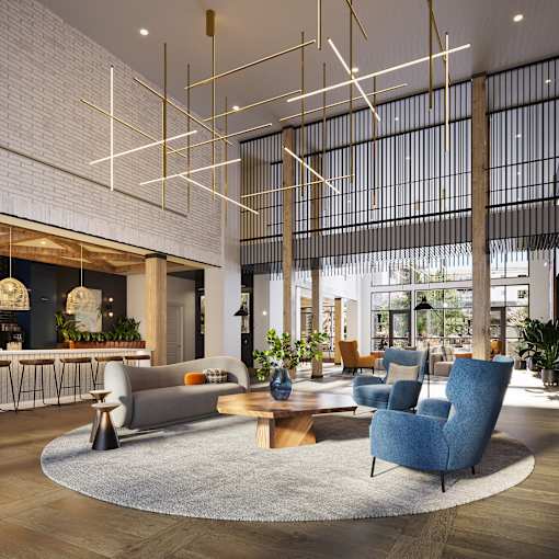 a rendering of a lobby with couches chairs and a table