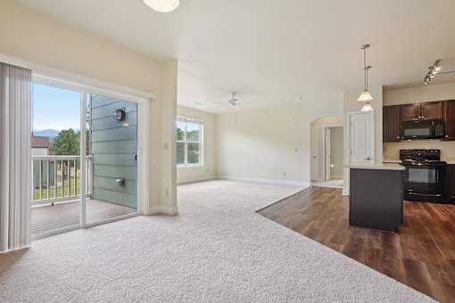 A living room with a television and a sliding glass door.
