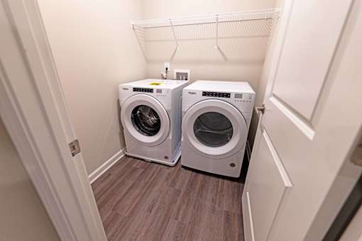 a small laundry room with a washer and dryer