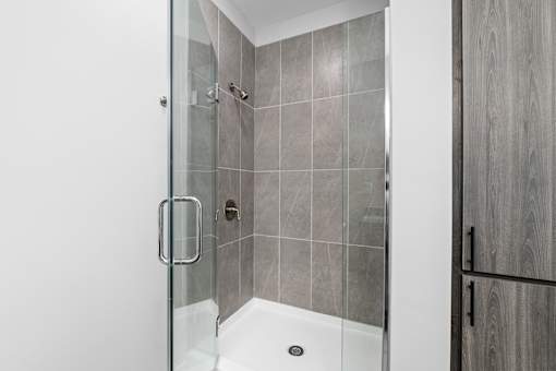A modern bathroom with a walk-in shower.