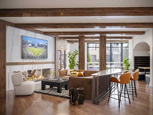 A modern living room with a large TV screen and comfortable seating.