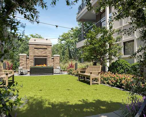 A backyard with a fireplace and a bench.