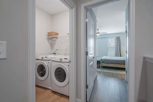 A laundry room with a washer and dryer in it.