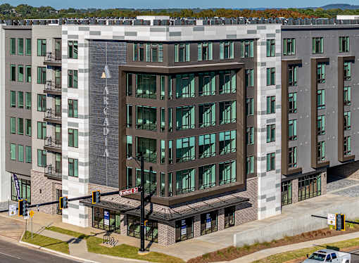 A modern building with the word "ARCADIA" on the front.