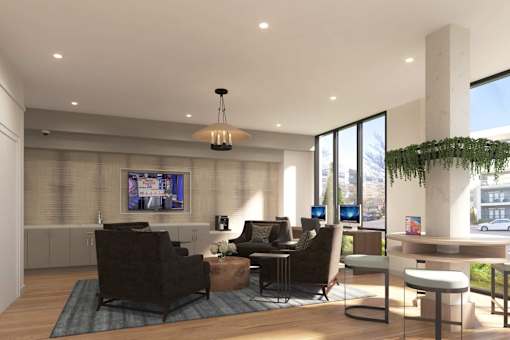 A modern living room with a large window and a flat screen TV mounted on the wall.