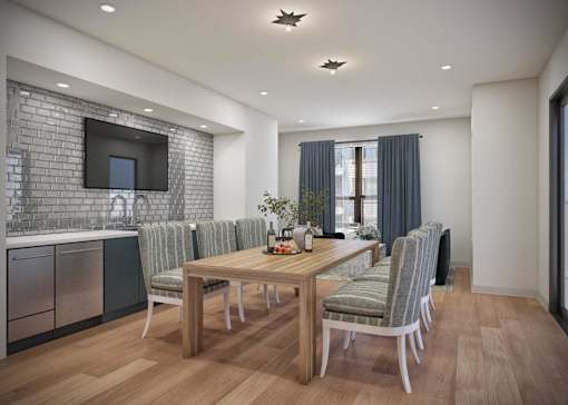 A modern dining room with a wooden table and chairs.