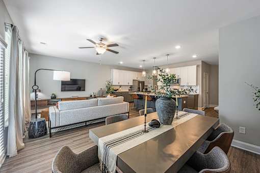 a living room and dining room with a couch and a table
