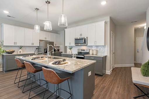a kitchen with a counter top and a sink