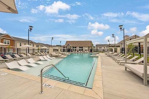 the swimming pool at the estates apartments