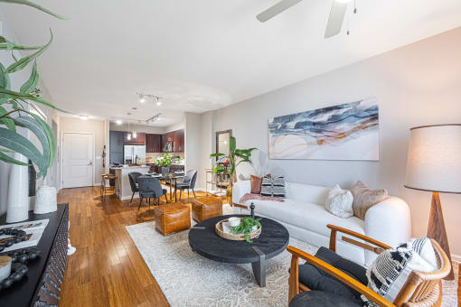 a living room and dining room with a couch and a table