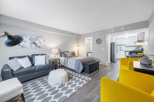 a living room with a couch and a bed