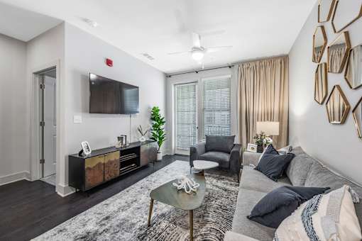 a living room with a couch and a tv