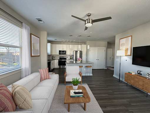 A modern living room with a white couch and a wooden coffee table.