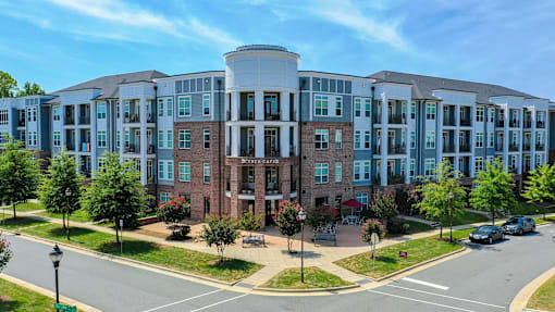 A large multi-story building with a mix of brick and glass windows.