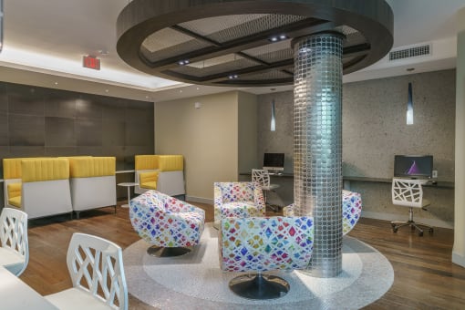 a living room with chairs and a pillar
