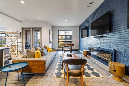 a living room with a couch and a fireplace and a television