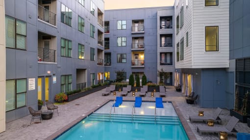 a swimming pool in the middle of an apartment building