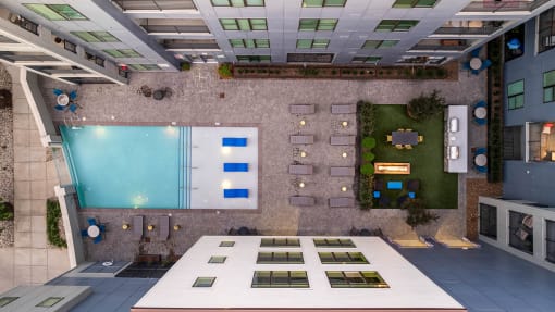 a rendering of the lobby of a building with an indoor pool