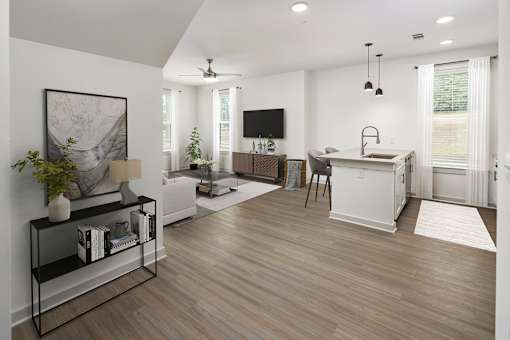a living room with a kitchen and a television
