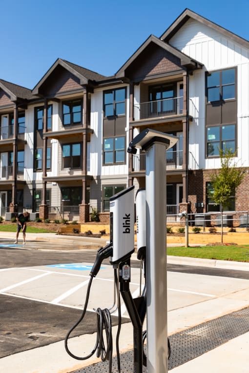 1-Bedroom Apartments in Belmont, NC - The Banks Apartments - Electric Vehicle Charging Station in Parking Lot of Apartment Complex.