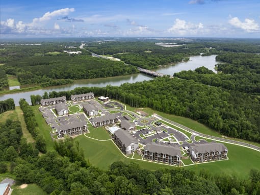 an aerial view of a campus with a river