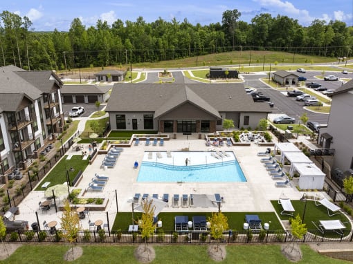 an aerial view of the pool at the resort on a sunny day