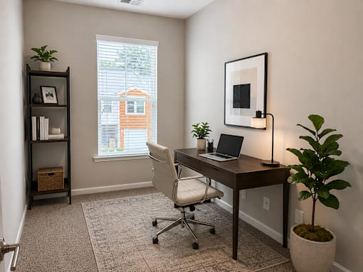 office area with desk and shelf and wall art