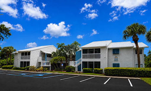 A sunny day at the apartment complex with clear blue skies.