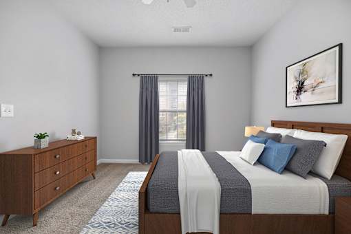 A bedroom with a large bed and a dresser.