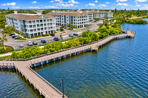 A large building with a dock in front of it.