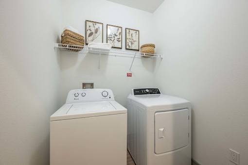 A laundry room with a washer and dryer.